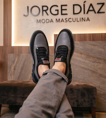 Colección de zapatos casuales para hombre en tres variantes de color: camel con negro, gris con negro y negro total monocromático, todos con sistema de cordones elásticos ajustables, costuras reforzadas y suela deportiva con detalles geométricos
