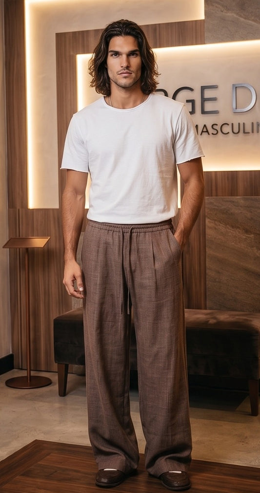 Pantalón casual holgado de corte ancho para hombre con cintura elástica de cordón ajustable y textura tipo lino, disponible en colores negro, café y beige crema