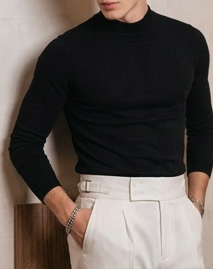 Pantalón de vestir elegante para hombre con pretina ancha estilo Gurkha, cierre de doble botón, pinzas frontales y ajustadores laterales, disponible en colores negro, marrón camel, gris plomo y blanco marfil en tienda Jorge Díaz Moda Masculina.