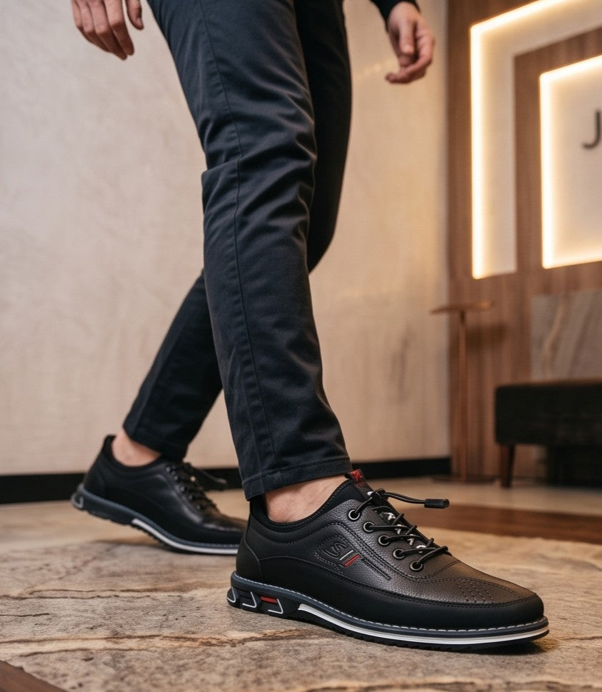 Zapato casual y ergonómico para hombre en acabado de cuero con cordones elásticos ajustables y suela deportiva antideslizante, disponible en cuatro colores: negro, gris, marrón café y camel.
