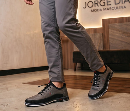 Zapato casual y ergonómico para hombre en acabado de cuero con cordones elásticos ajustables y suela deportiva antideslizante, disponible en cuatro colores: negro, gris, marrón café y camel.